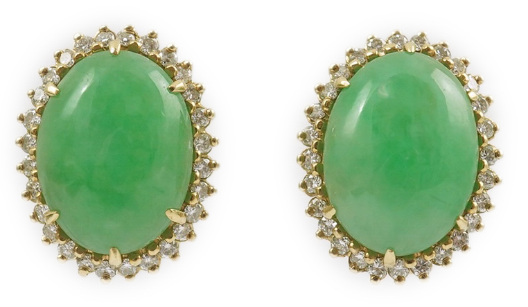 A pair of mid 20th century gold, cabochon jade and diamond cluster set oval earrings